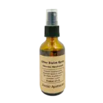 Amber glass spray bottle of After Swim Chlorine Neutralizer with natural ingredients, showcasing product label.