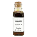Bottle of Sinclair Apothecary Lion’s Mane Infused Honey with cork stopper with cognitive and immune health benefits.