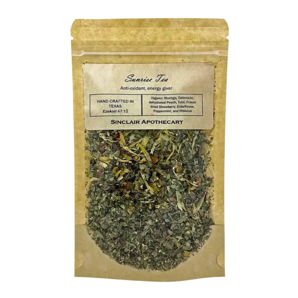 Organic Sunriise Tea with herbs, dried fruit, and vibrant ingredients in eco-friendly packaging.