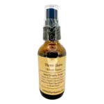 Small amber throat spray bottle with herbal ingredients, labeled “Three Guns,” for sore throat relief.